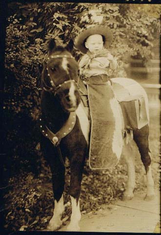 Ron on a pony at 2 years old